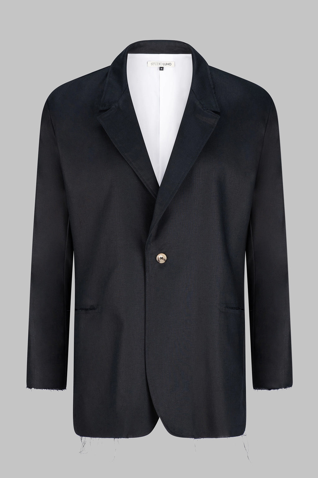 Front view of the Studio Luho deconstructed European linen blazer in black.