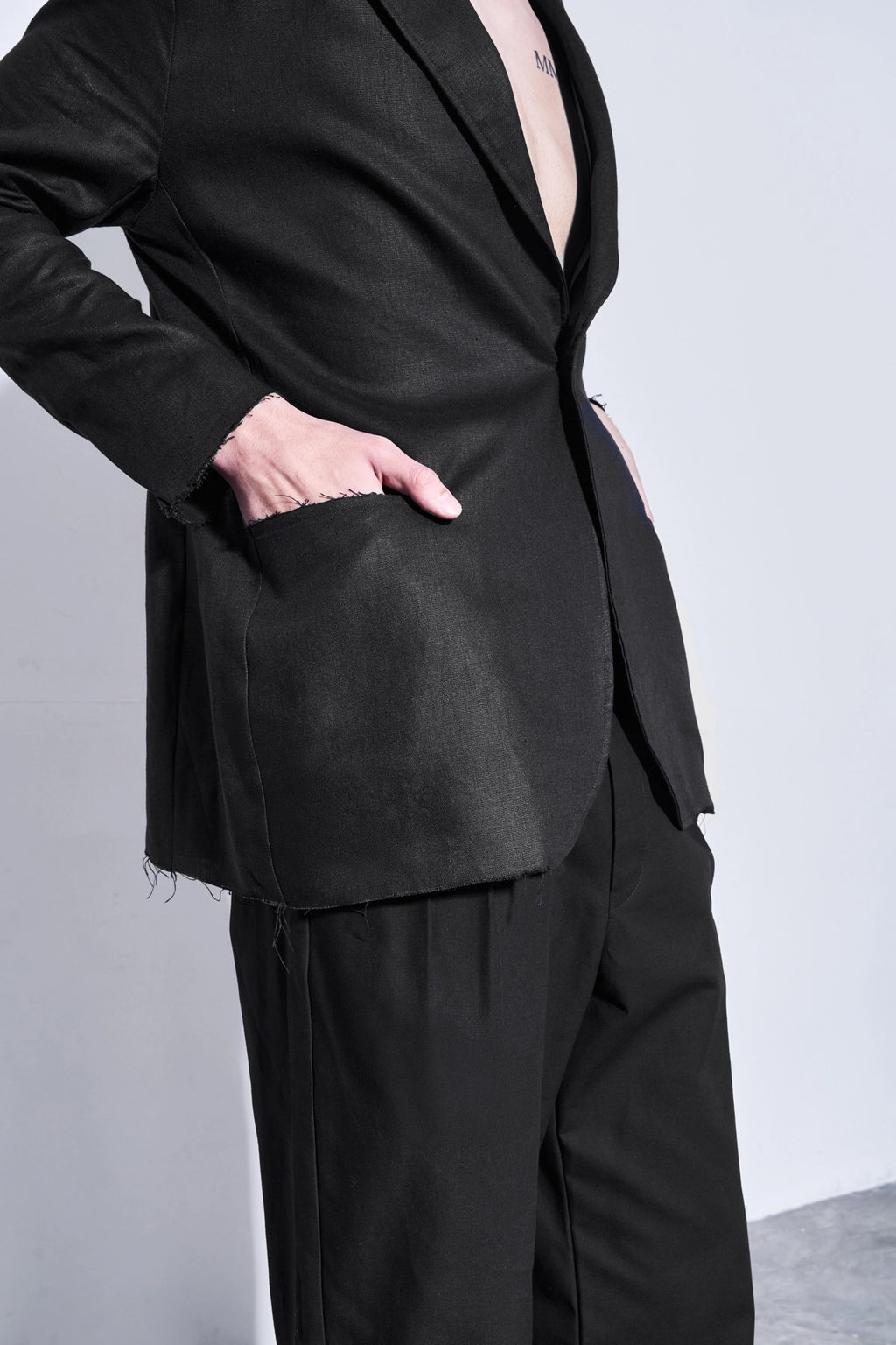 Model wearing the unstructured black linen blazer from Studio Luho, designed in Melbourne.