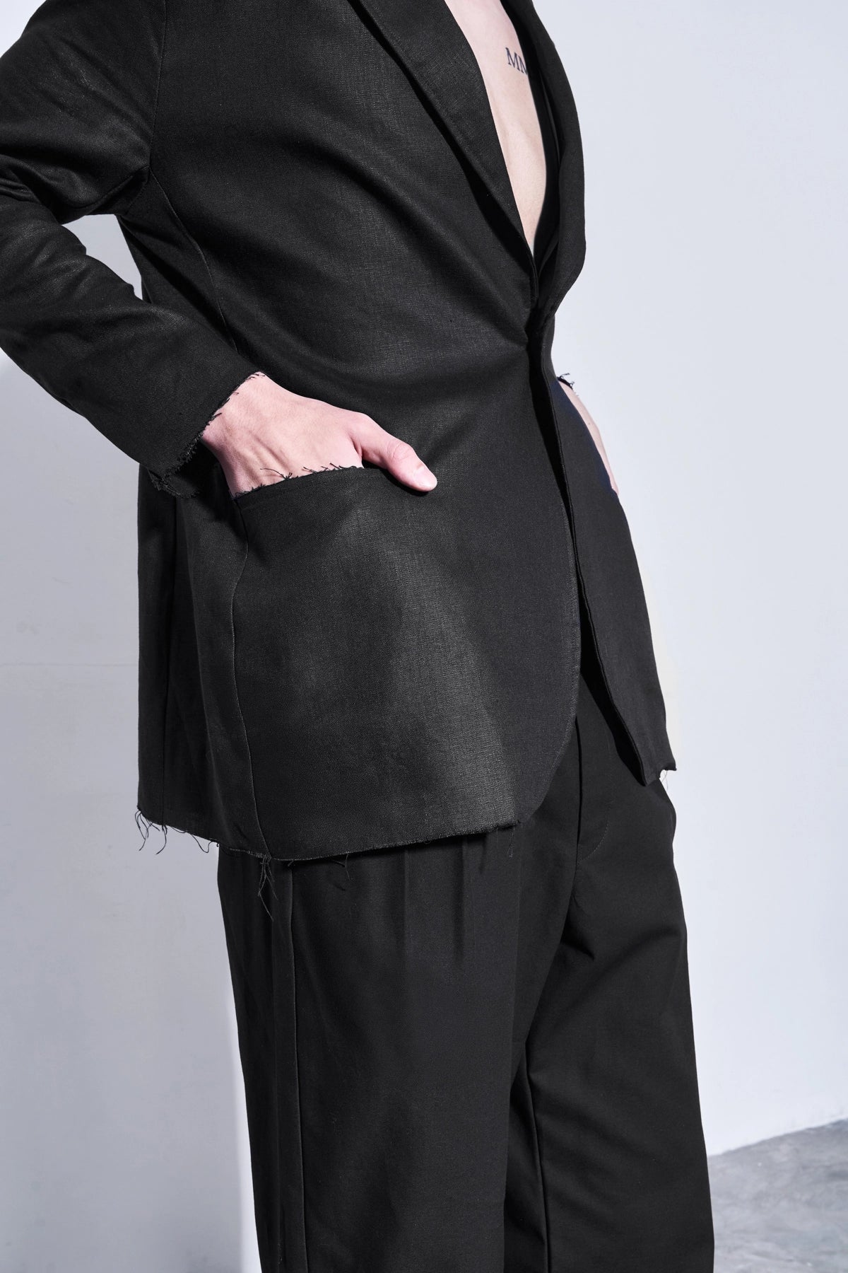 Model wearing the unstructured black linen blazer from Studio Luho, designed in Melbourne.