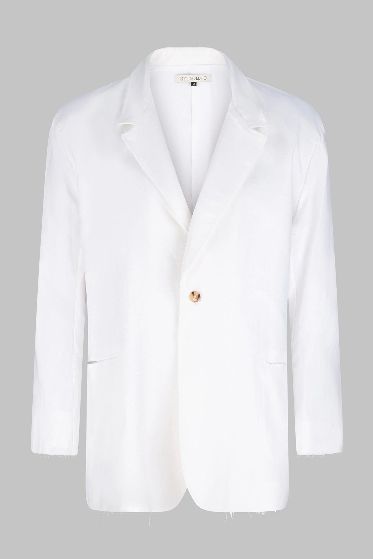 Front view of the Studio Luho deconstructed European linen blazer in white.