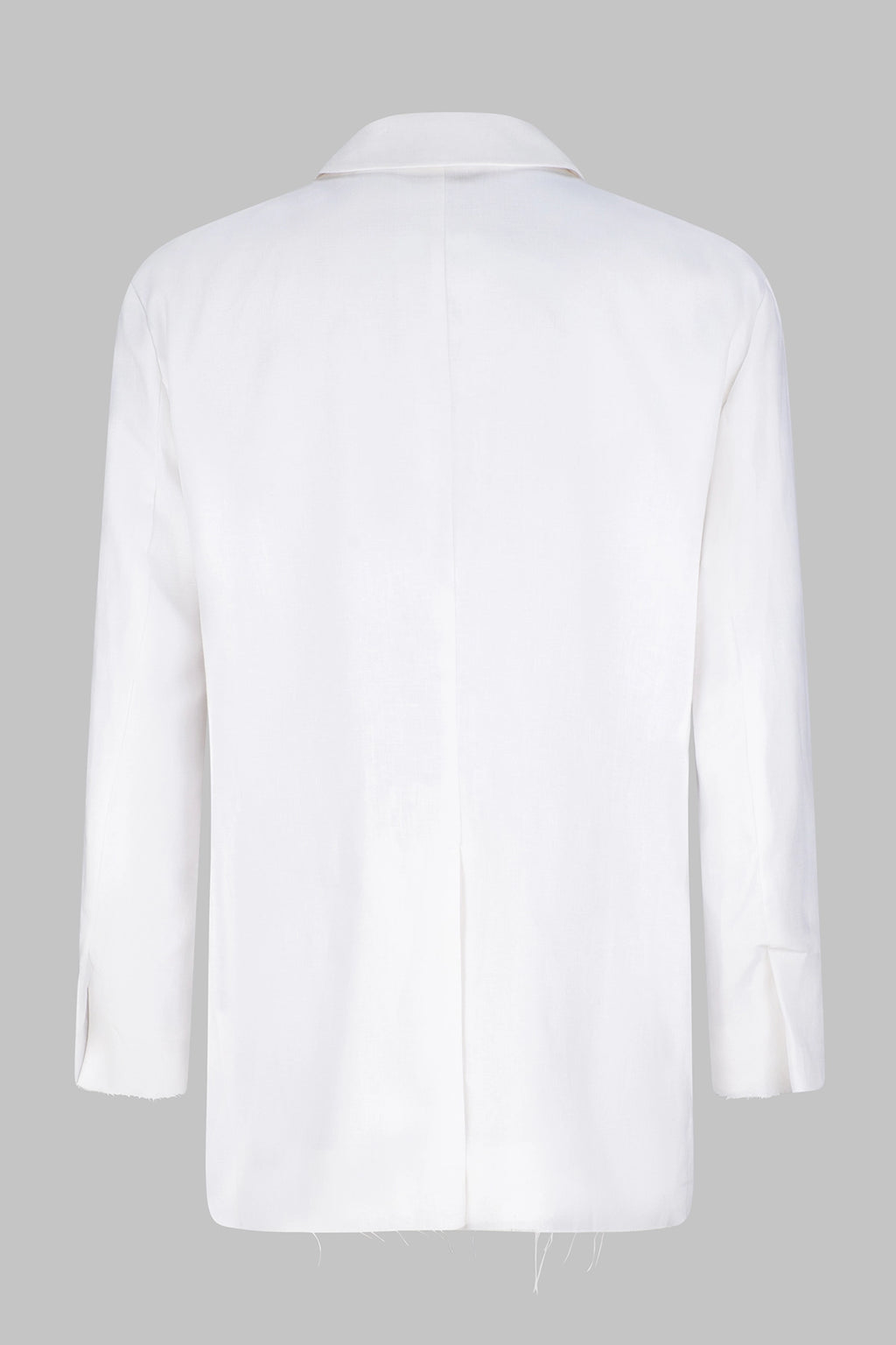 Back view of the Studio Luho deconstructed European linen blazer in white.