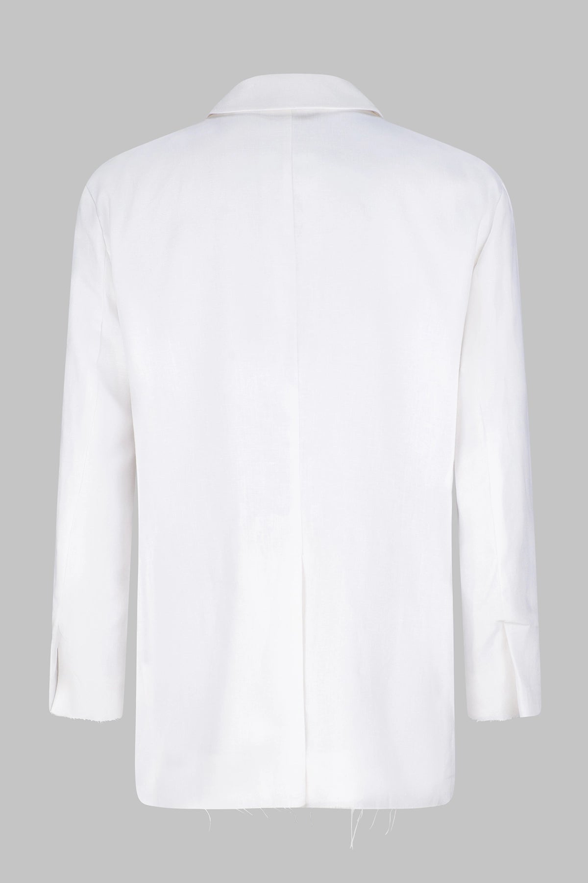 Back view of the Studio Luho deconstructed European linen blazer in white.