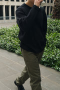 Man wearing Studio Luho Waffle Knit Crew in black 