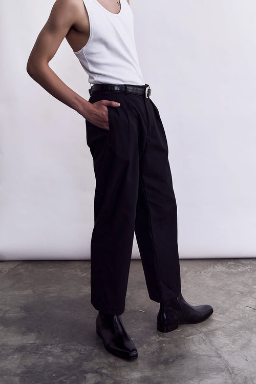 Model wearing the Studio Luho black cotton trousers, a Melbourne-made relaxed fit chino
