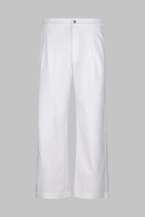 Front view of the Studio Luho relaxed fit pleated cotton trousers in white