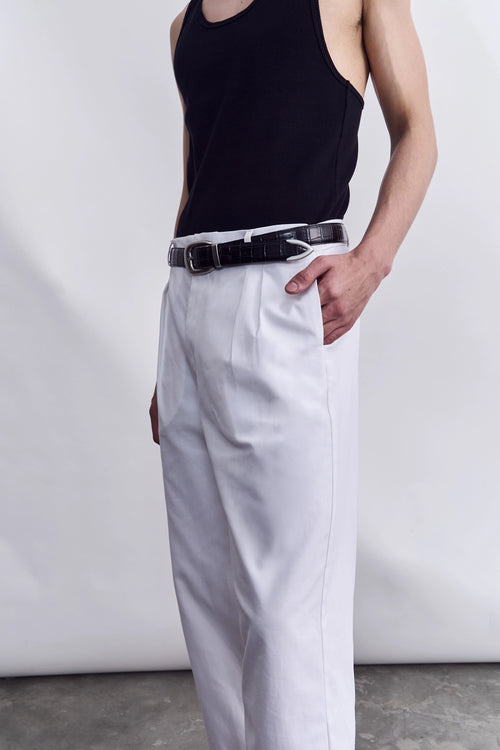 Model wearing the Studio Luho white cotton trousers, a Melbourne-made relaxed fit chino.