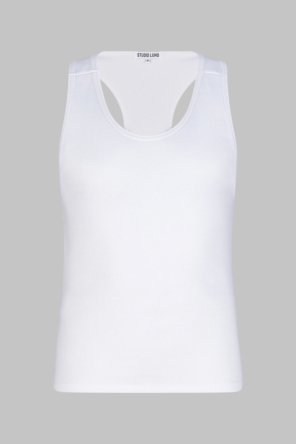 Front view of the Studio Luho minimalist racerback tank in white organic cotton.