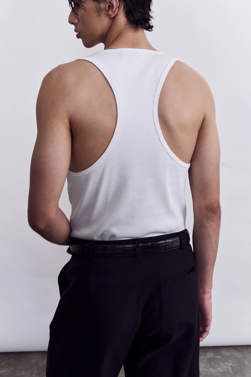 Model wearing the Studio Luho organic cotton racerback tank top, made in melbourne. 