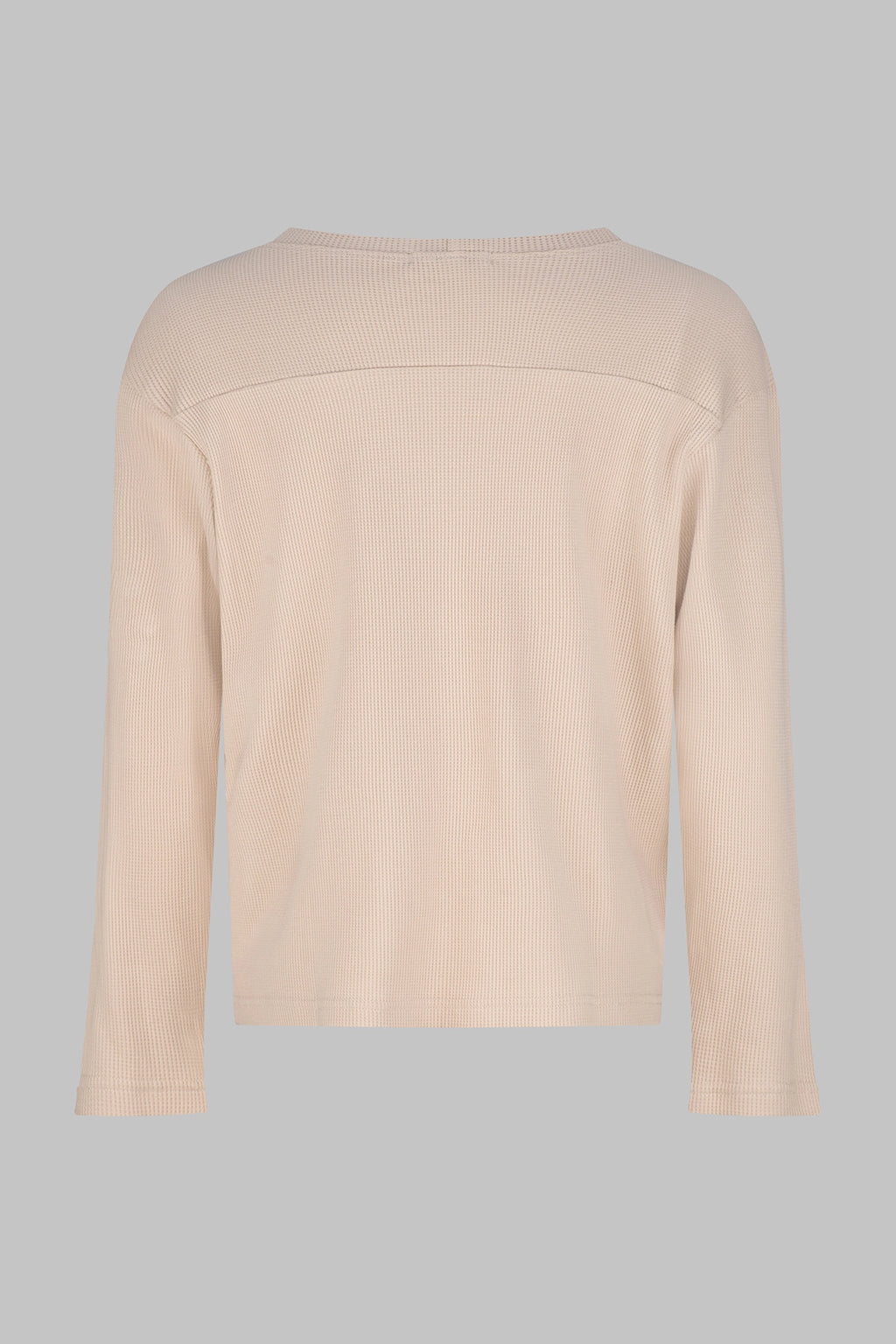 Back view of the Studio Luho organic cotton waffle knit long sleeve in sand.