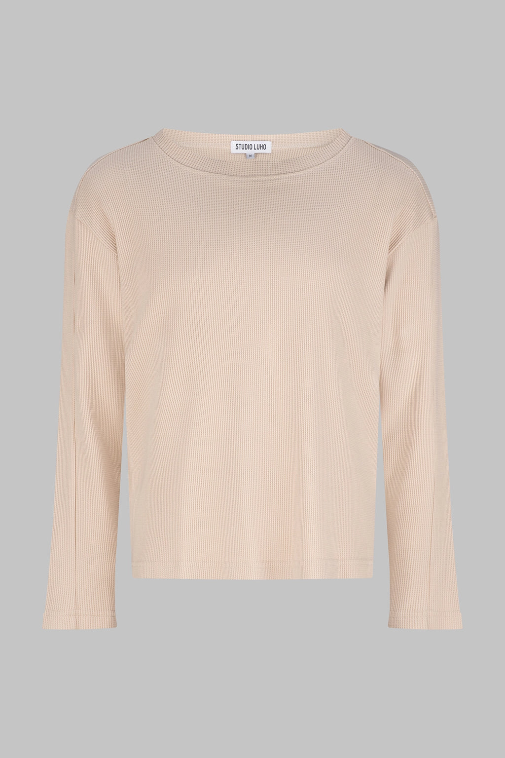 Front view of the Studio Luho organic cotton waffle knit long sleeve in sand.
