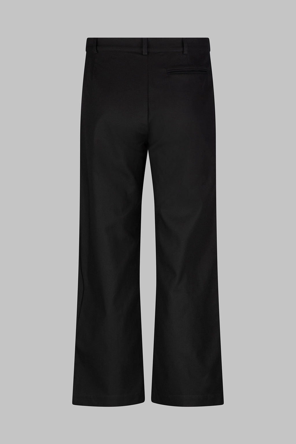 Back view of the Studio Luho relaxed fit pleated cotton trousers in black